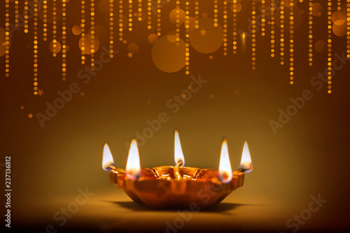 Happy Diwali diya with bokeh background