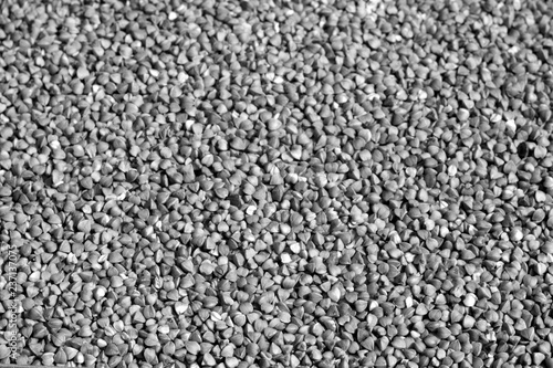 Pile of buckwheat close-up in black and white.