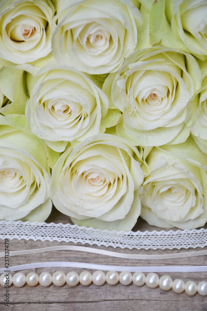 White roses on wooden background White roses on wooden background