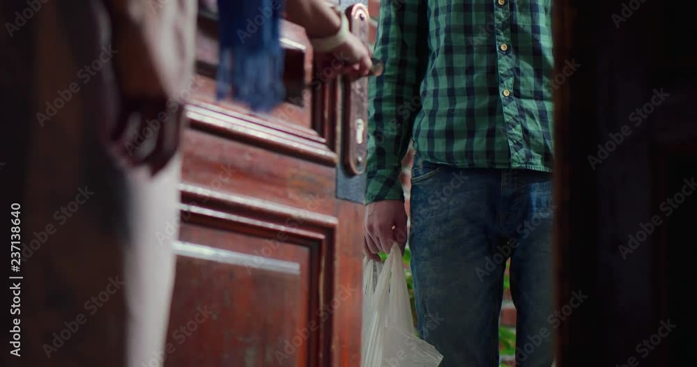 Girl pays with card and terminal for courier delivery of food from market Girl pays with card and terminal for courier delivery of food from market