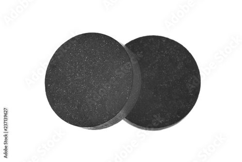 activated carbon pills isolated on white background
