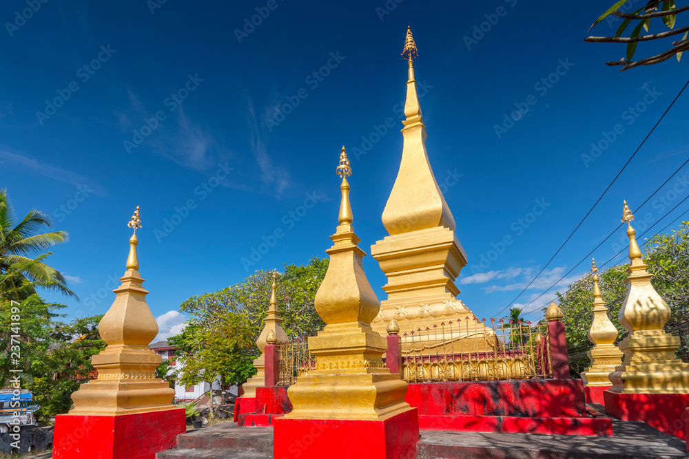 Golden stupas at Wat Manorom, Buddhist temple, Luang Prabang, Laos. Golden stupas at Wat Manorom, Buddhist temple, Luang Prabang, Laos.