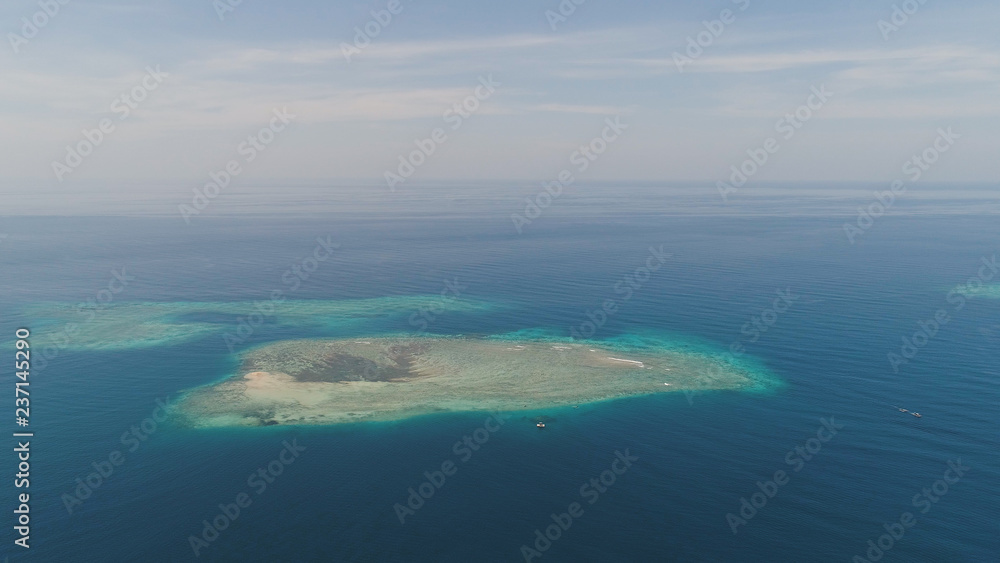 seascape aerial view coral reef, atoll with turquoise water in sea.Tropical atoll, coral reef in ocean waters. Travel concept.