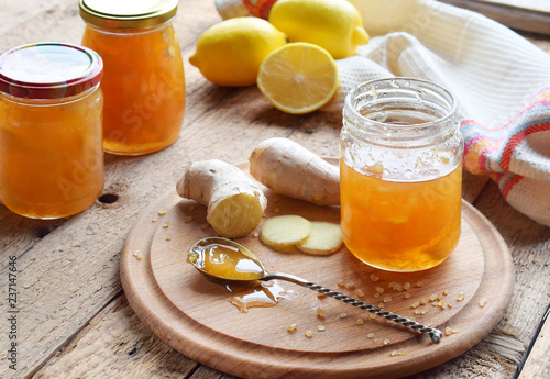 Homemade ginger and lemon jam on wooden background. Natural products to support the immune system in winter. Herbal medicine. Healthy food