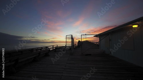 Walking onto the Kure Beach pier at dawn