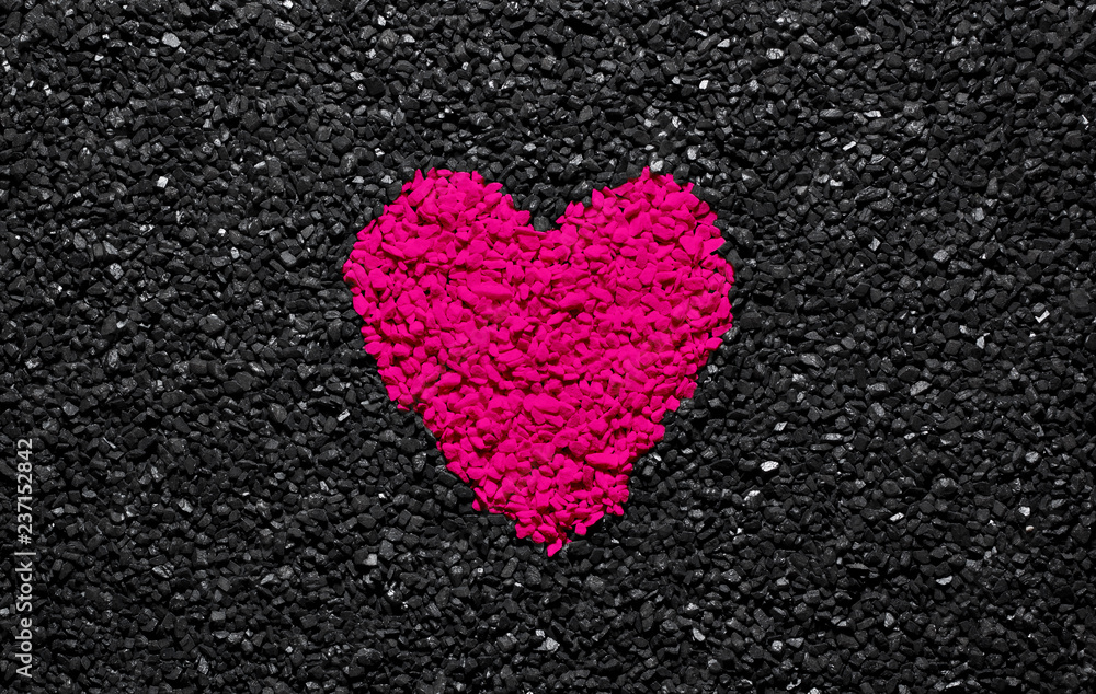 Plastic Pink colour, trendy colour, heart on the black textured background, stones, gravel and shingle, love wallpaper, valentine Plastic Pink colour, trendy colour, heart on the black textured background, stones, gravel and shingle, love wallpaper, valentine