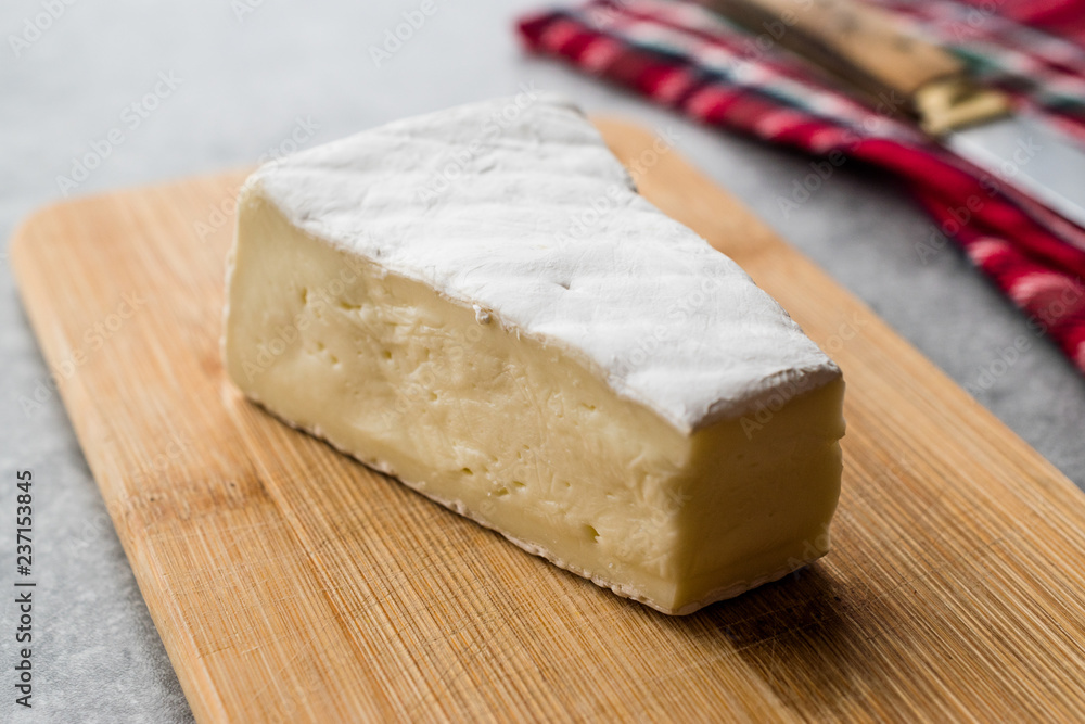 Whole Brie Cheese on Wooden Board / Camembert Cheese. Whole Brie Cheese on Wooden Board / Camembert Cheese.