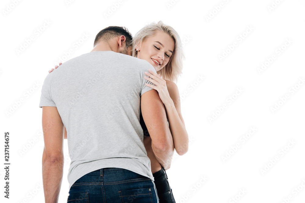 smiling heterosexual couple passionately hugging isolated on white smiling heterosexual couple passionately hugging isolated on white