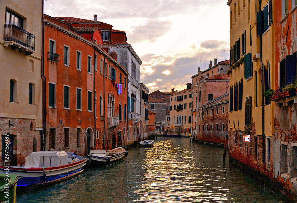 Venice colorful corners on sunset with  old buildings and architecture, boats and beautiful water reflections, Italy