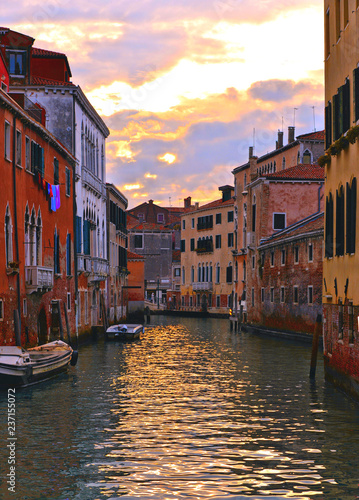 Venice colorful corners on sunset with  old buildings and architecture, boats and beautiful water reflections, Italy