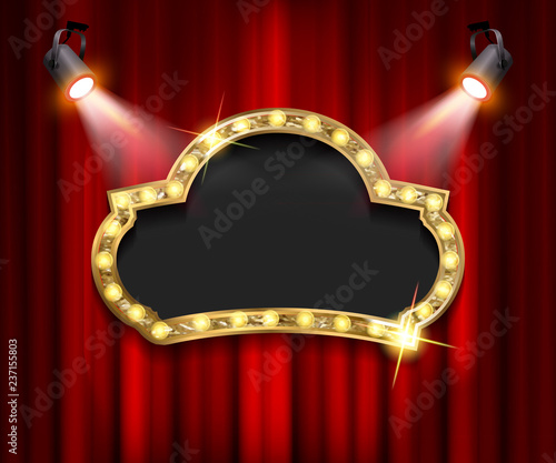Theater sign on curtain with spotlight.