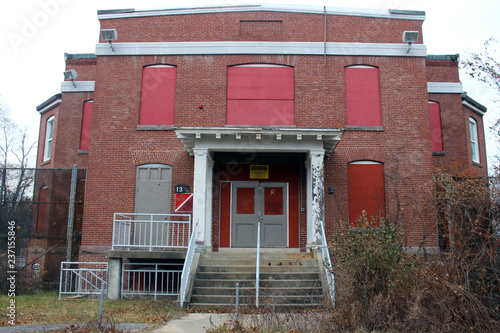 Fényképezés Boarded up and abandoned brick mental hospital asylum building