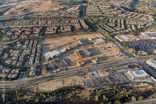 Aerial late afternoon view of homes, shopping center construction and Rinaldi Street in the fast growing Porter Ranch neighborhood of Los Angeles, California.   © trekandphoto