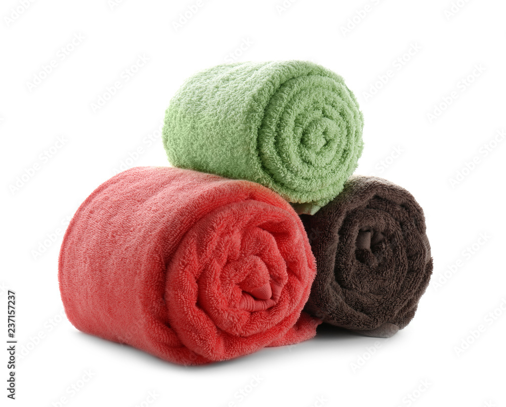 Rolled clean soft towels on white background Rolled clean soft towels on white background