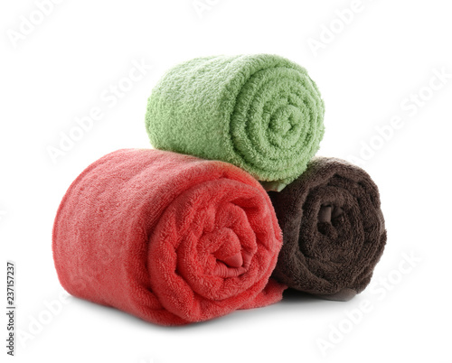 Rolled clean soft towels on white background