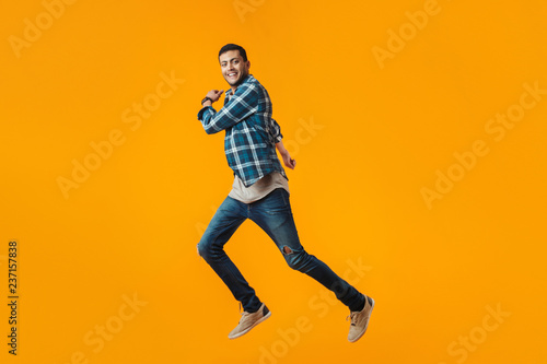 Full length portrait of a happy young man