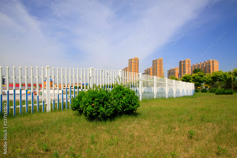 lawn fences and buildings in the park