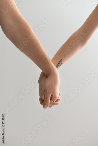Man and woman holding hands...