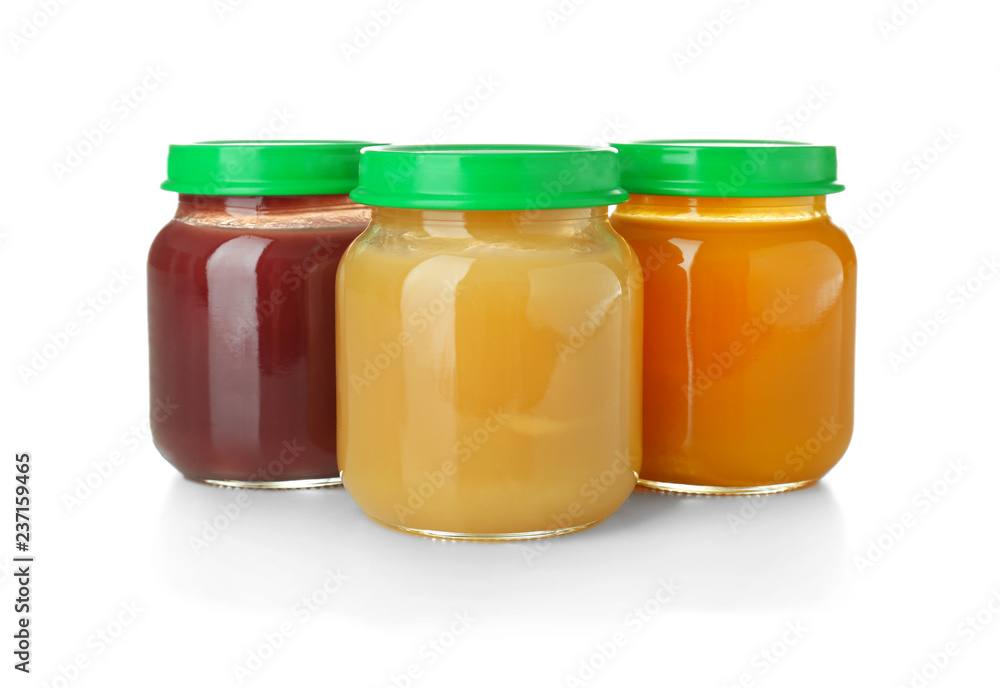 Glass jars with healthy baby food on white background Glass jars with healthy baby food on white background