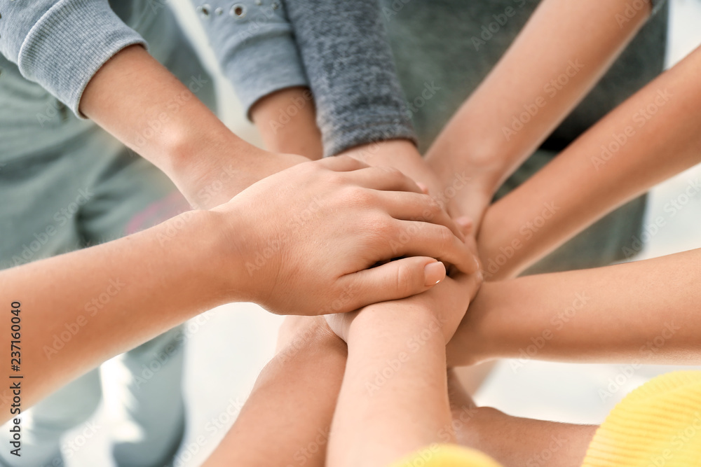 People putting hands together, closeup. Unity concept People putting hands together, closeup. Unity concept