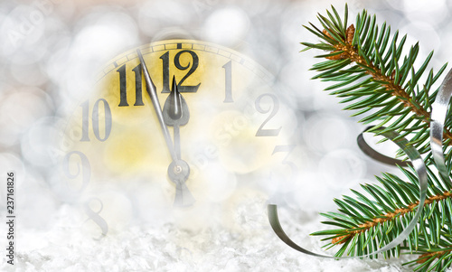 Detail of clock face and Christmas twig before midnight