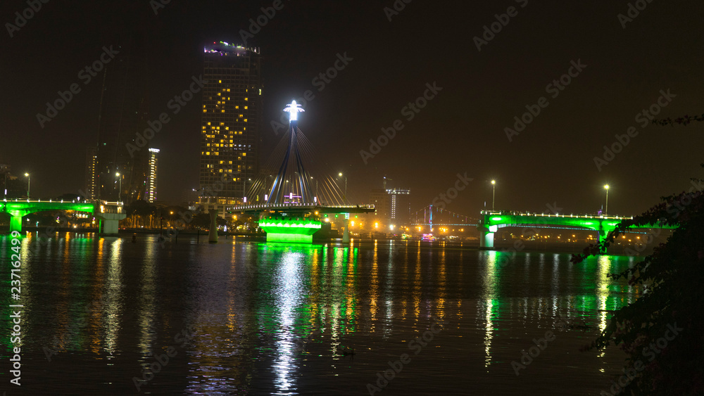 Han river bridge in Danang is opening in the evening ligtining with different colors.Vietnam