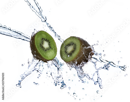 Kiwi fruit with water splash flying in the air isolated on white background