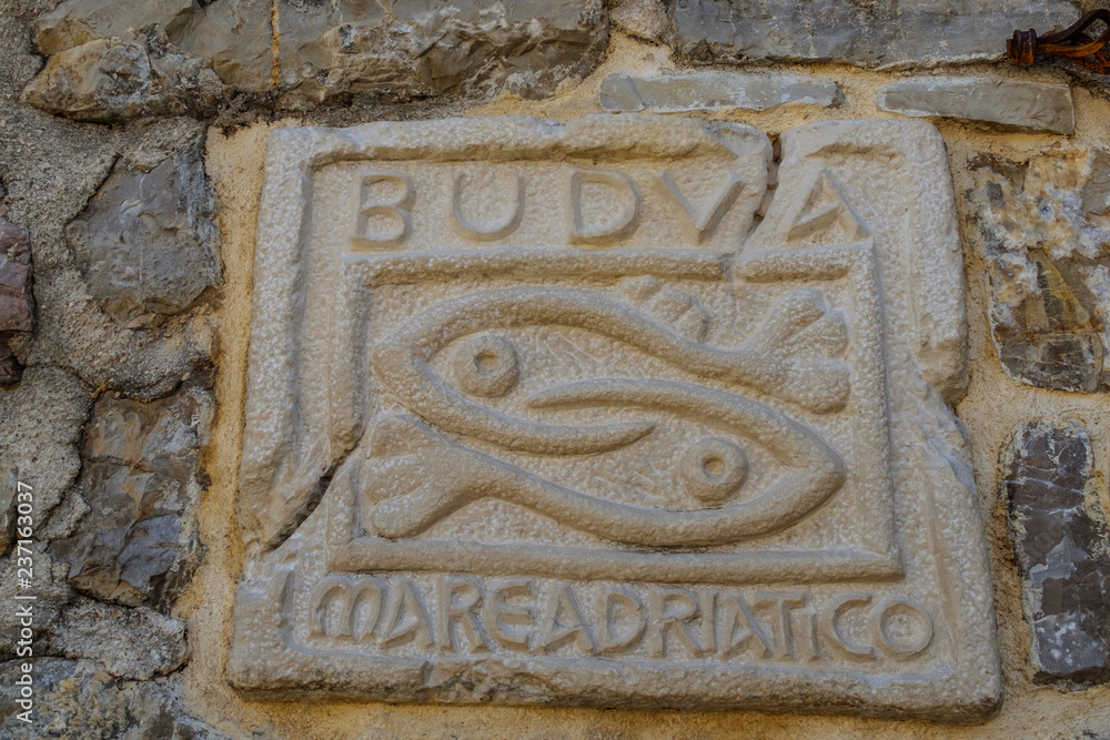 relief on a stone a symbol of fish Montenegro budva