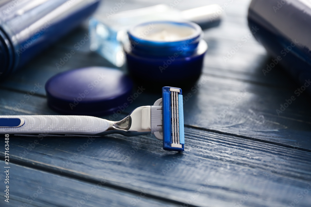 Razor on wooden table Razor on wooden table
