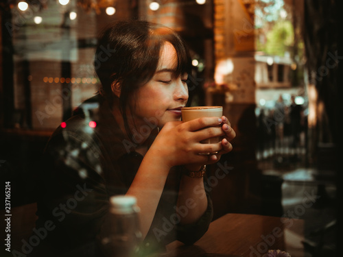 Wallpaper Mural Asian woman drinking coffee in  coffee shop cafe Torontodigital.ca