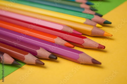 closeup of colouring pencils on color background