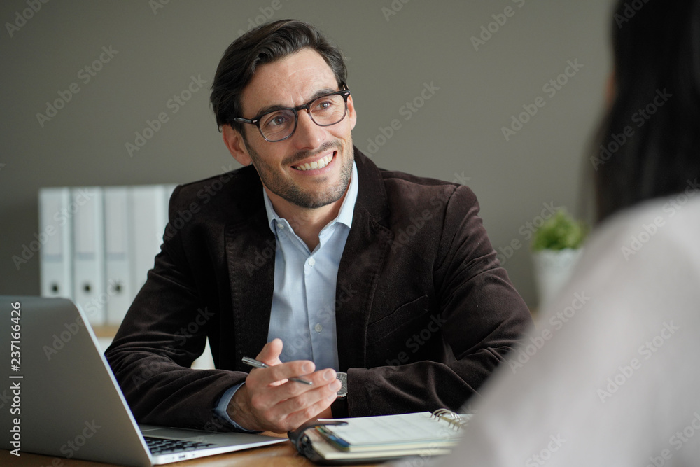 Smart professional male with client in office Smart professional male with client in office