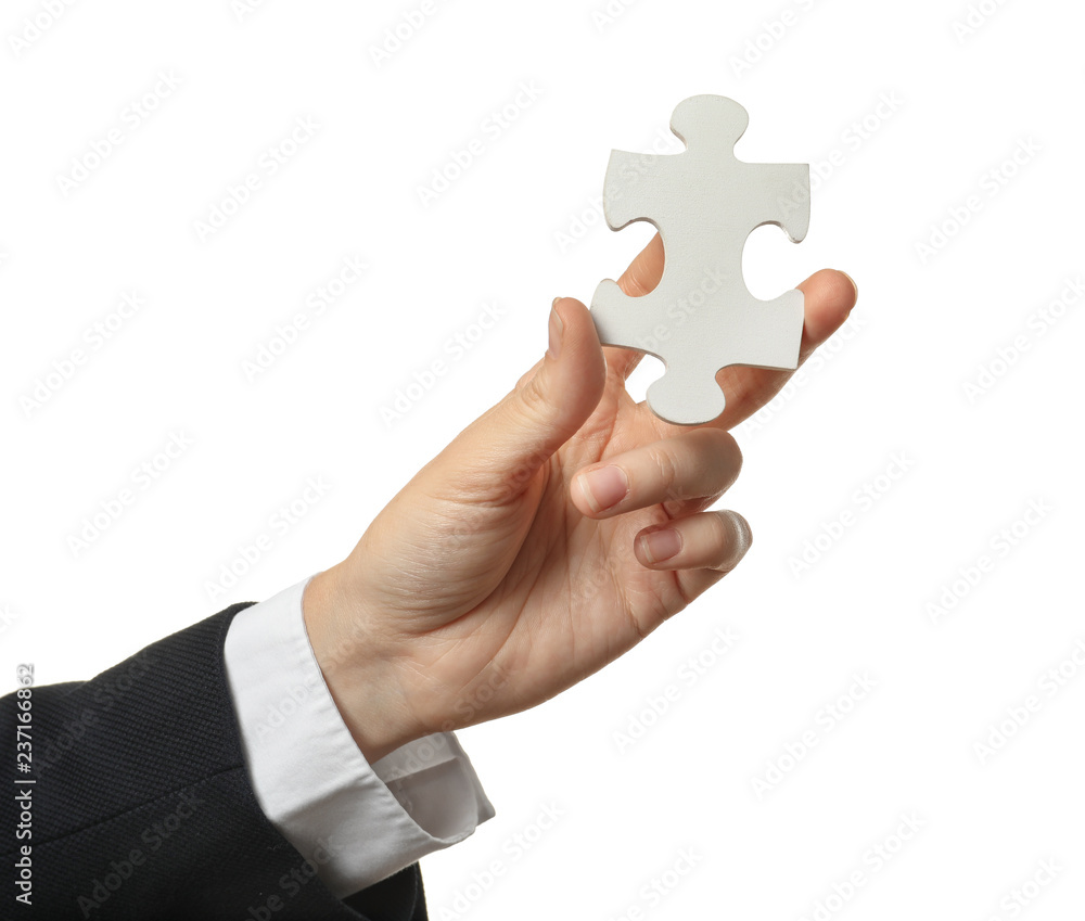 Woman with piece of puzzle on white background Woman with piece of puzzle on white background