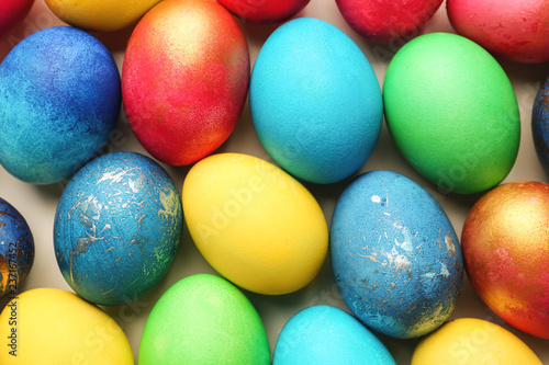 Easter eggs on light background, top view