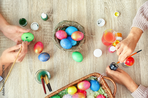 Women painting Easter eggs ...