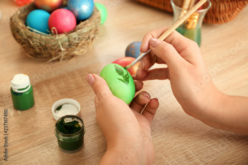 Woman painting Easter eggs ...