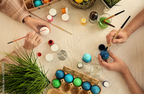 Women painting Easter eggs ...