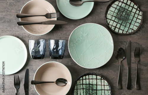 Set of clean tableware on grey background photo