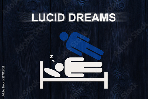 Tableau sur toile Paper sleeping man on bed with text LUCID DREAMS