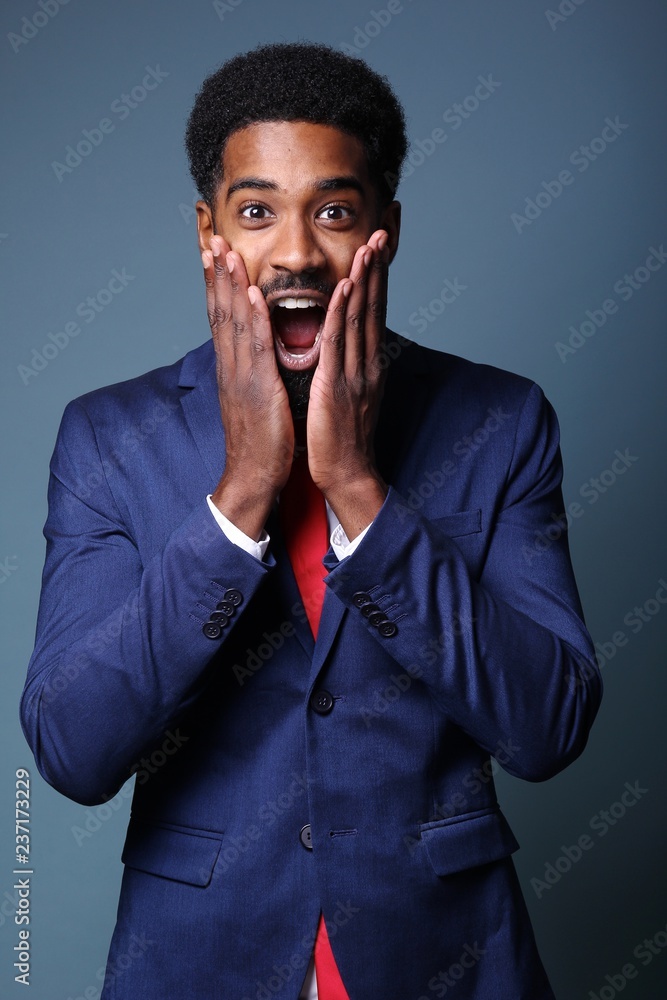 Beautiful black man in front of a colored background Beautiful black man in front of a colored background