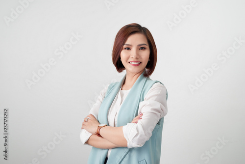 Fotografie Entrepreneur young asian woman, business woman arms crossed on white background