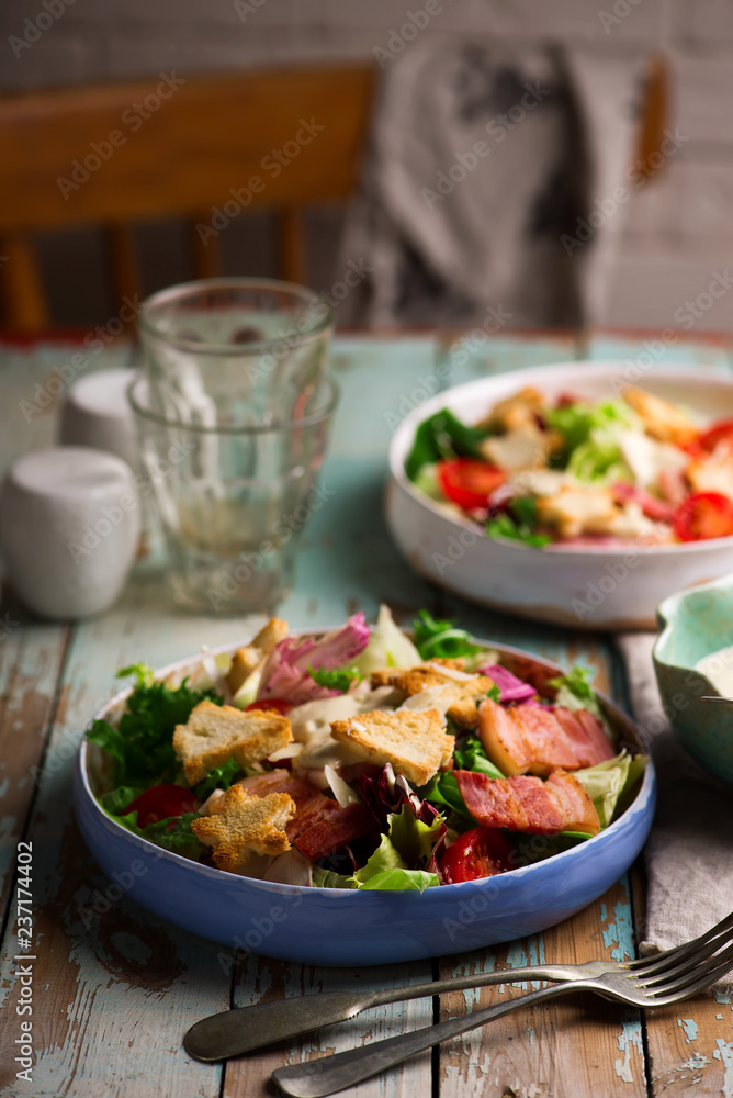 Caesar salad in ceramic bowl .selective focus Caesar salad in ceramic bowl .selective focus