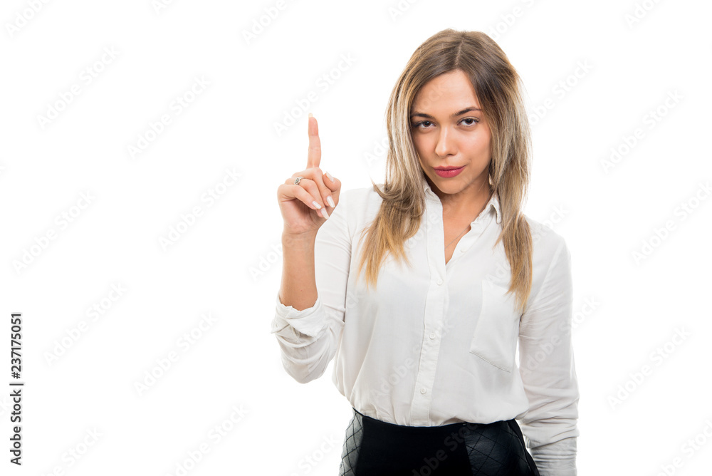 Young pretty business woman showing number one gesture Young pretty business woman showing number one gesture