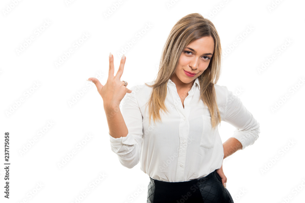 Young pretty business woman showing number three gesture Young pretty business woman showing number three gesture