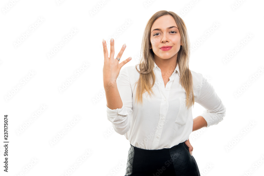 Young pretty business woman showing number four gesture Young pretty business woman showing number four gesture