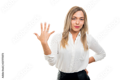 Young pretty business woman showing number five gesture