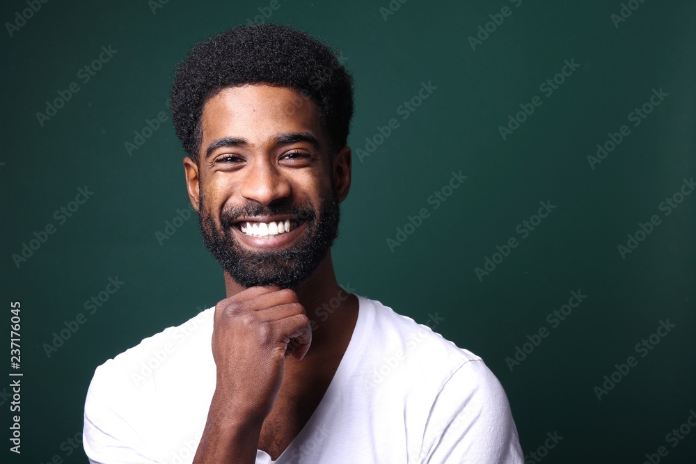 © Djomas - Beautiful black man in front of a colored background
