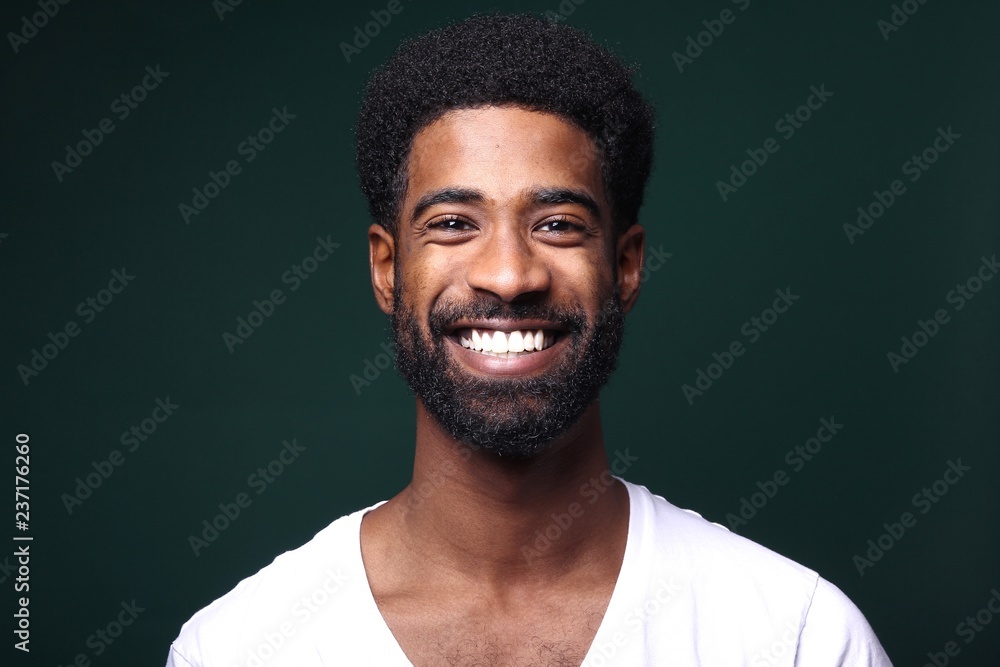 Beautiful black man in front of a colored background Beautiful black man in front of a colored background