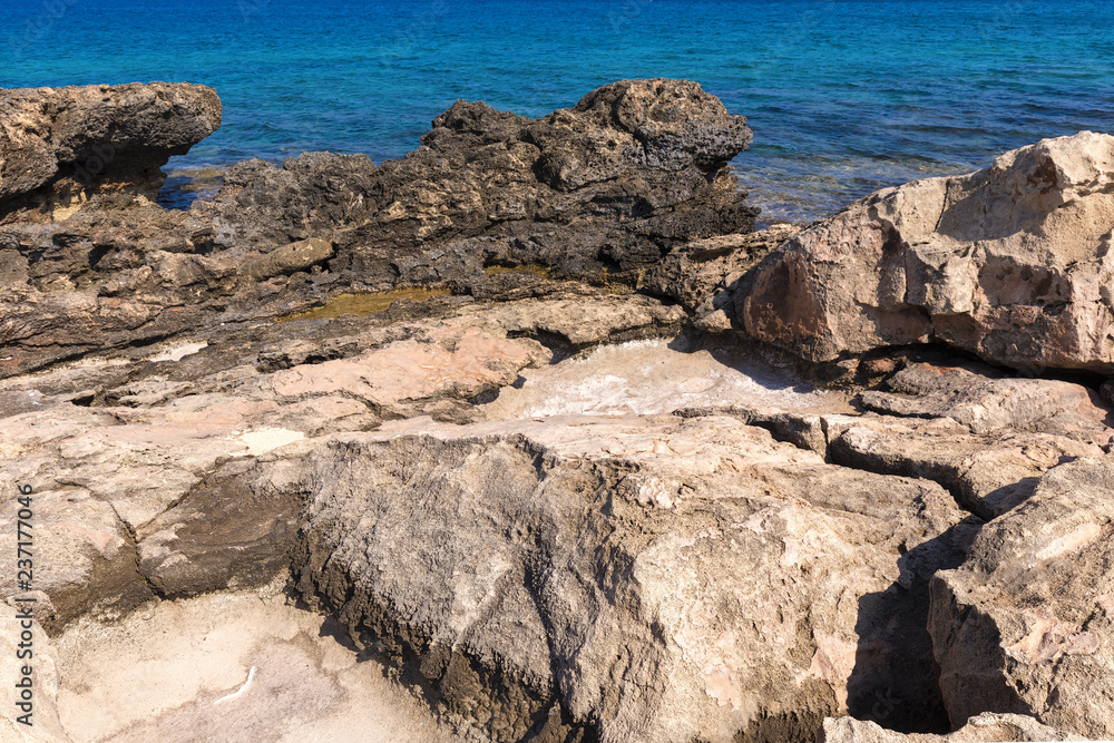Stony Mediterranean coast in the vicinity of Protaras, Cyprus. Summer Sunny day of August.