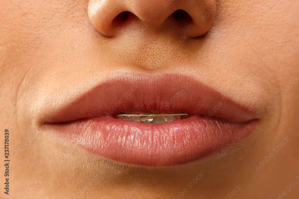 Fototapeta premium Beautiful woman face lips nose closeup beauty skin care concept
